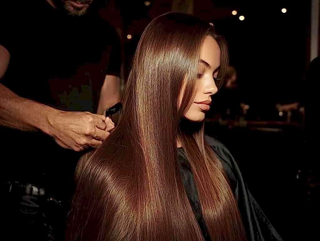 Hair extension aftercare at luxury salon, smooth brushed extensions